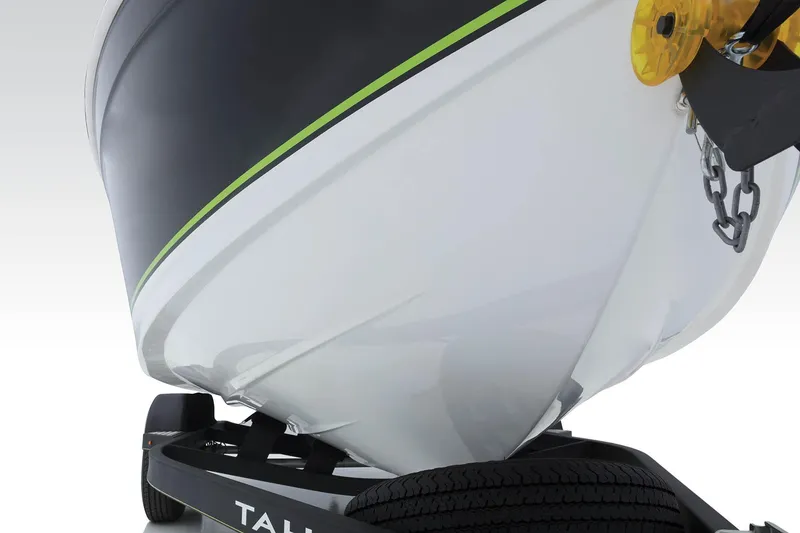 Slide: The Image of 2023 Tahoe 210 Si Limited boat on trailer, showcasing sleek hull design. - 9