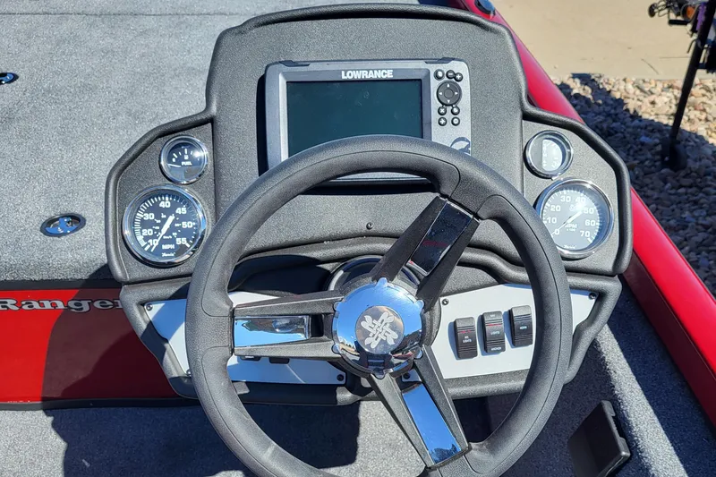 Slide: The Image of 2023 Ranger RT188 boat dashboard with Lowrance fishfinder and steering wheel. - 4