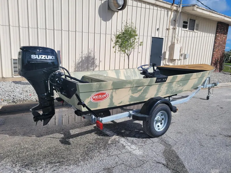 Slide: The Image of 2021 Hog Island Boat Works SW16 with Suzuki outboard motor on trailer. - 12