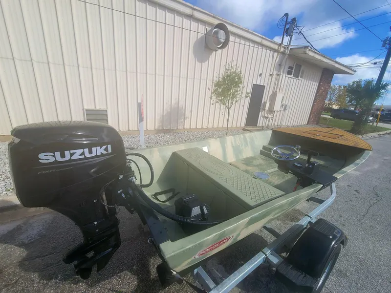 Slide: The Image of 2021 Hog Island Boat Works SW16 with Suzuki outboard motor on trailer. - 5