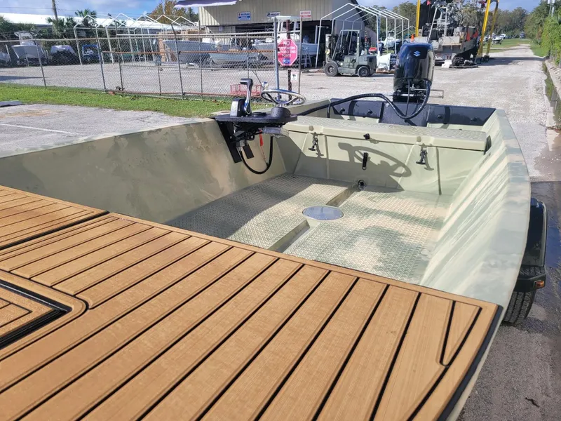 Slide: The Image of 2021 Hog Island Boat Works SW16 with wooden deck and outboard motor. - 8