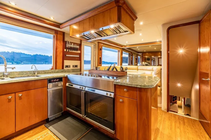 Slide: The Image of Luxurious dining area on a 2002 Westport Flybridge yacht with elegant decor. - 10