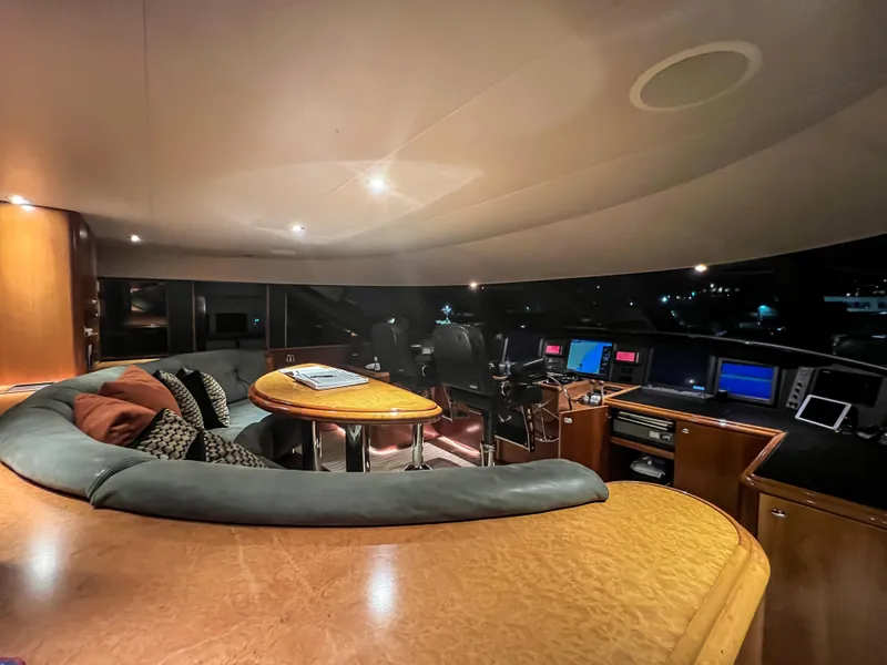 Slide: The Image of Luxurious interior of a 2002 Westport Flybridge yacht with elegant seating and large windows. - 14