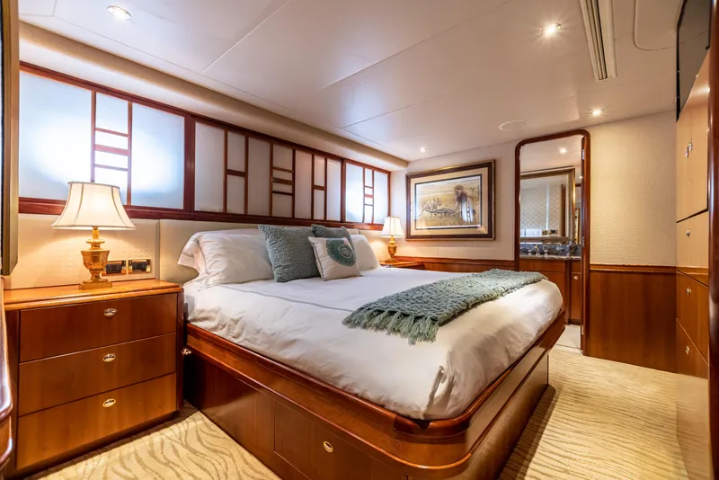 Slide: The Image of Luxurious interior of 2002 Westport Flybridge yacht with elegant staircase and cozy bedrooms. - 24