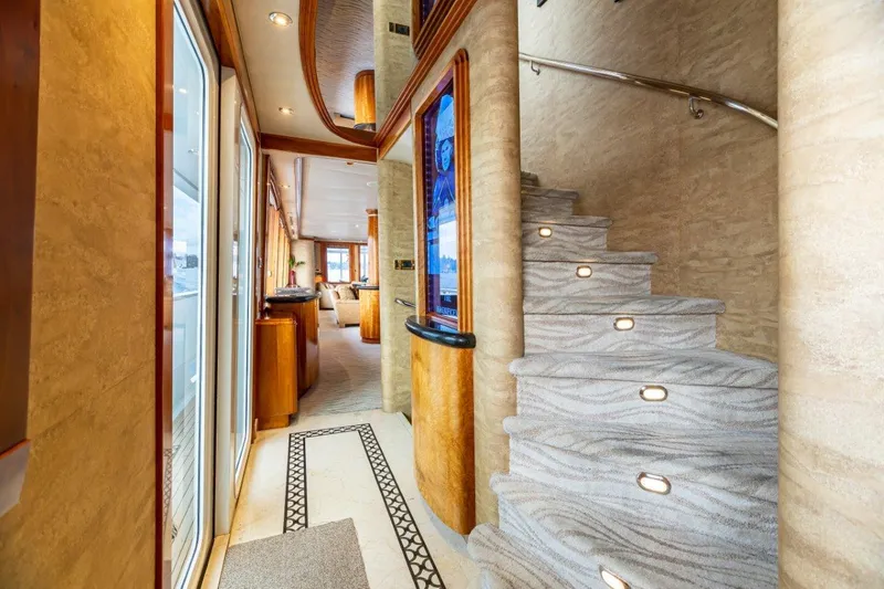 Slide: The Image of Luxurious twin bedroom on a 2002 Westport Flybridge yacht with elegant wood finishes. - 30