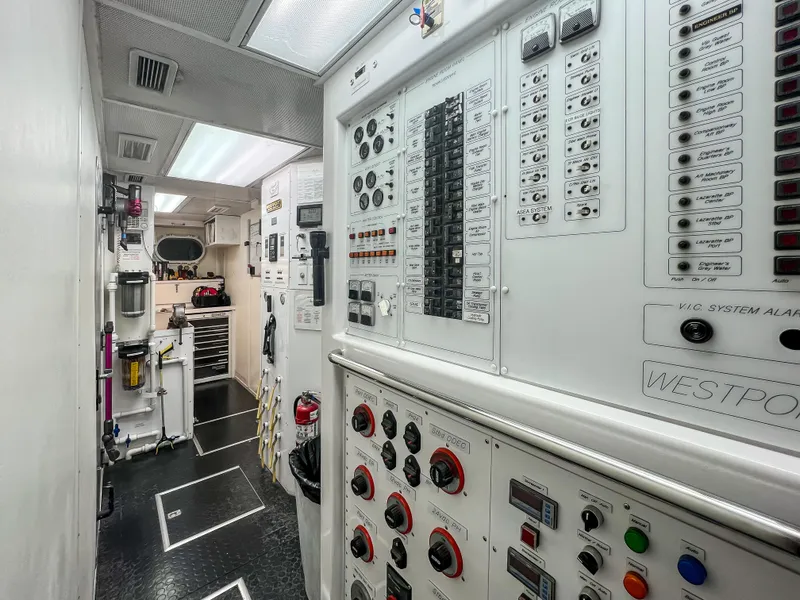 Slide: The Image of Interior of 2002 Westport Flybridge yacht with bar stools and panoramic windows. - 36