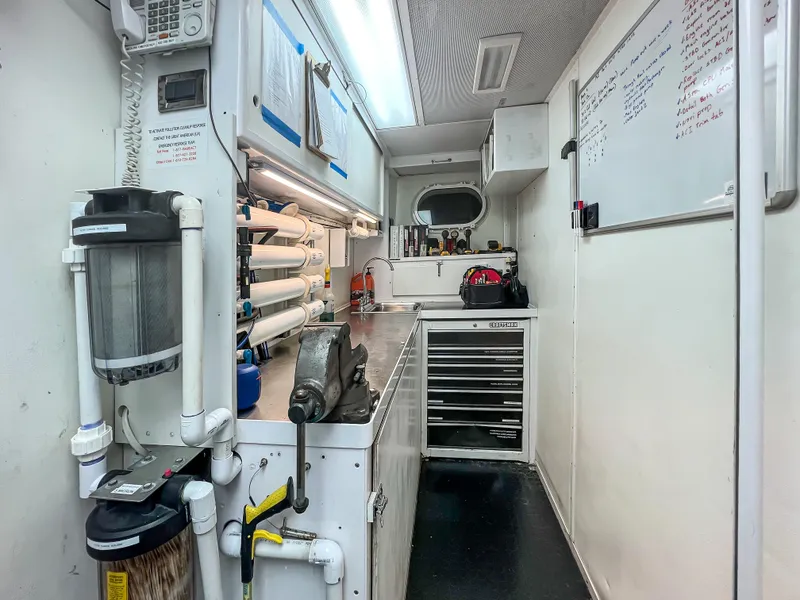 Slide: The Image of Control room of a 2002 Westport Flybridge yacht with various panels and equipment. - 37