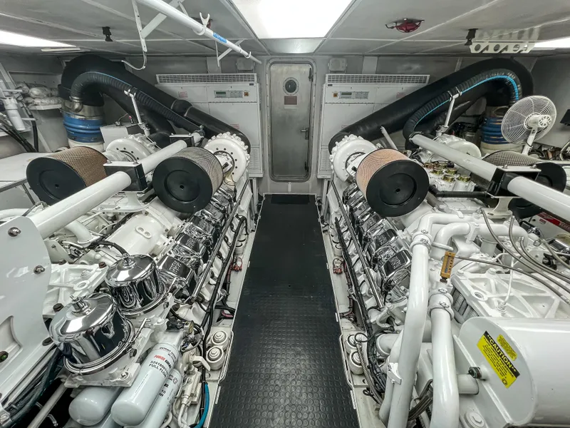 Slide: The Image of Engine room of a 2002 Westport Flybridge yacht with visible machinery and equipment. - 39
