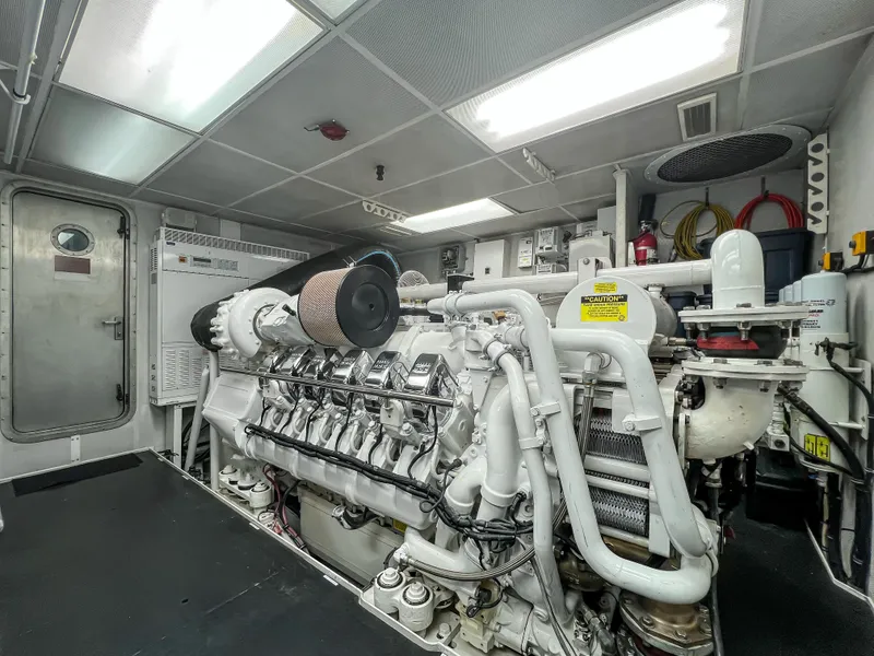 Slide: The Image of Engine room of a 2002 Westport Flybridge yacht with dual engines. - 40