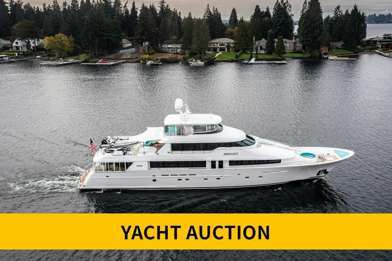 Slide: The Image of Westport Flybridge 2002 yacht illuminated at night, docked in a scenic harbor. - 42