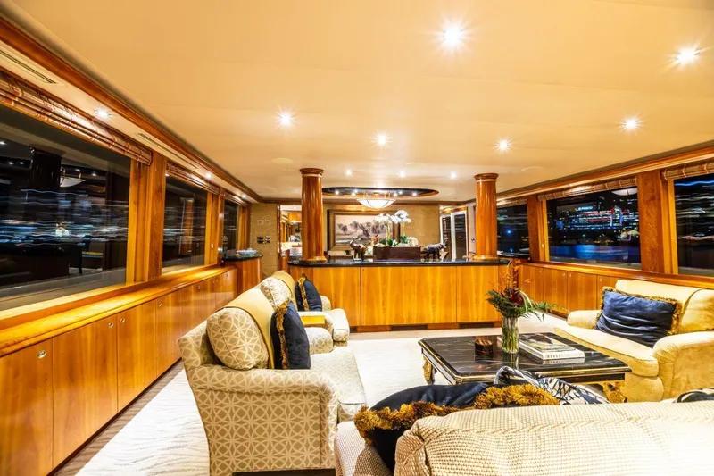 Slide: The Image of Luxurious interior of 2002 Westport Flybridge yacht with elegant furnishings and panoramic windows. - 8