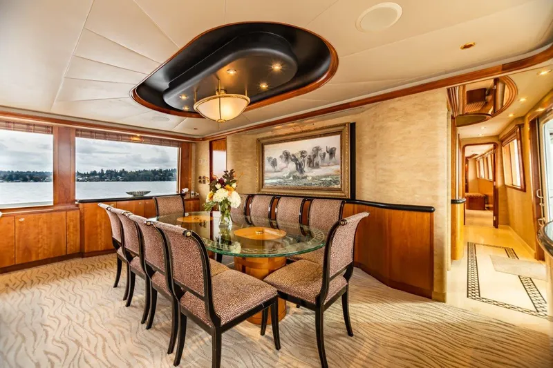 Slide: The Image of Luxurious interior of 2002 Westport Flybridge yacht with elegant seating and wooden finishes. - 9