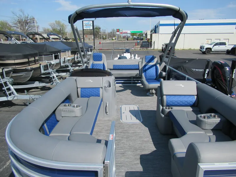 Slide: The Image of 2023 Bennington 24 LSBA pontoon boat with spacious seating and modern design. - 2