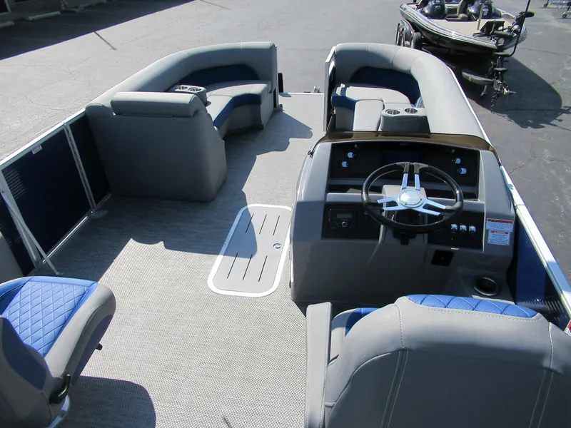 Slide: The Image of 2023 Bennington 24 LSBA pontoon boat interior with steering console and seating. - 4