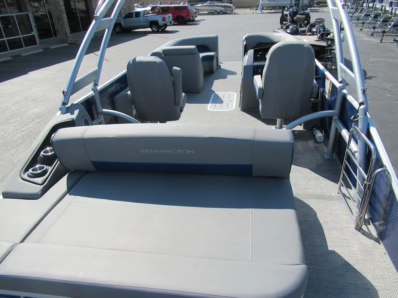 Slide: The Image of 2023 Bennington 24 LSBA pontoon boat interior with gray seating and helm. - 5