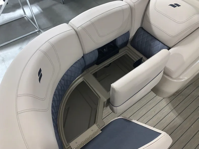 Slide: The Image of 2024 Starcraft SLS 3 DC boat interior with beige and blue seating. - 10