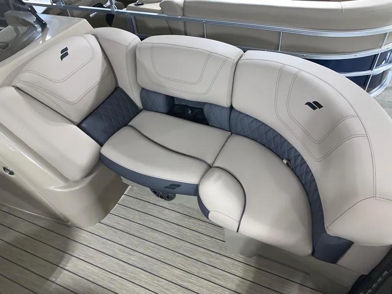 Slide: The Image of 2024 Starcraft SLS 3 DC boat interior seating with beige and gray upholstery. - 11