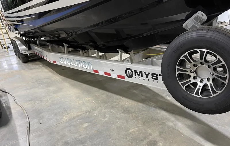Slide: The Image of Mystic 3800 boat on Evolution trailer, 2020 model, in a garage. - 14