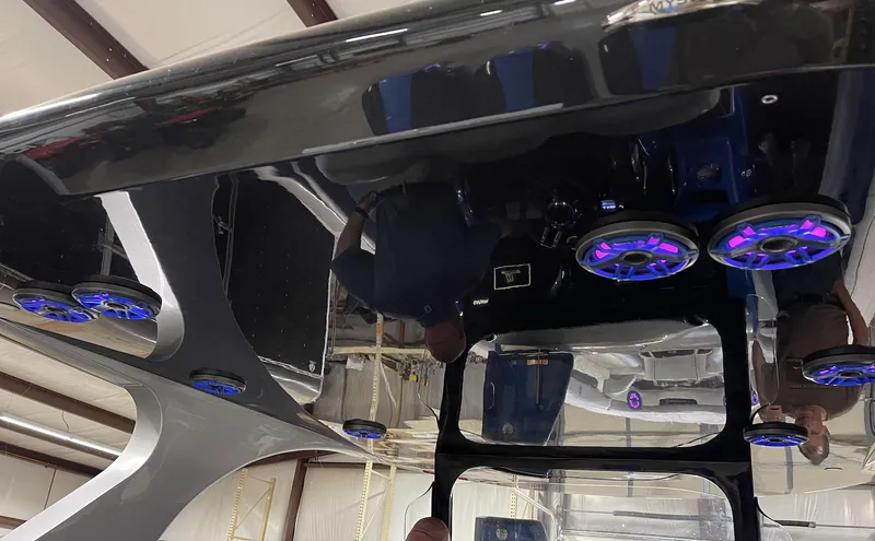 Slide: The Image of Mystic 3800 2020 model with illuminated speakers on the ceiling in a warehouse. - 16