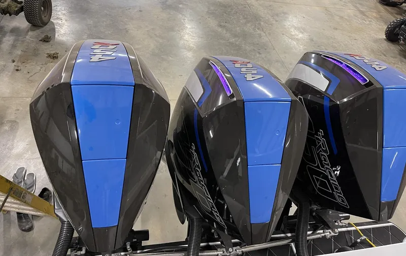 Slide: The Image of Three Mystic 3800 outboard motors, 2020 model, in a workshop. - 17