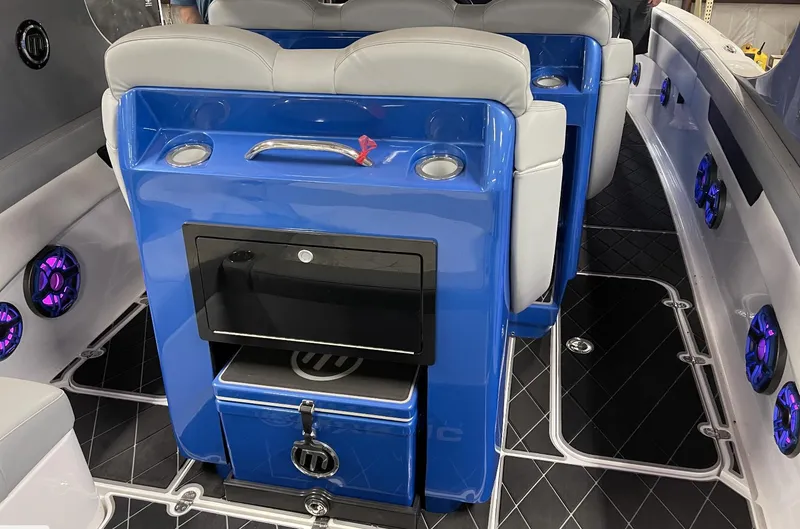 Slide: The Image of Luxury interior of 2020 Mystic 3800 boat with blue seating and modern amenities. - 19