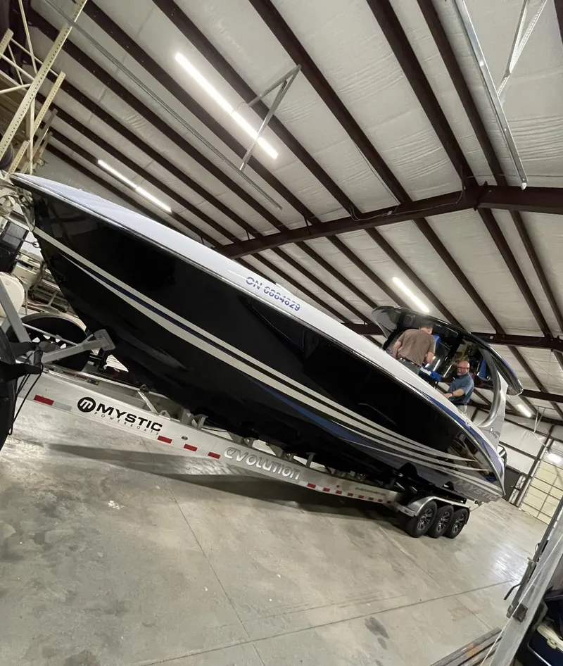 Slide: The Image of Mystic 3800 boat on trailer in warehouse, 2020 model. - 4
