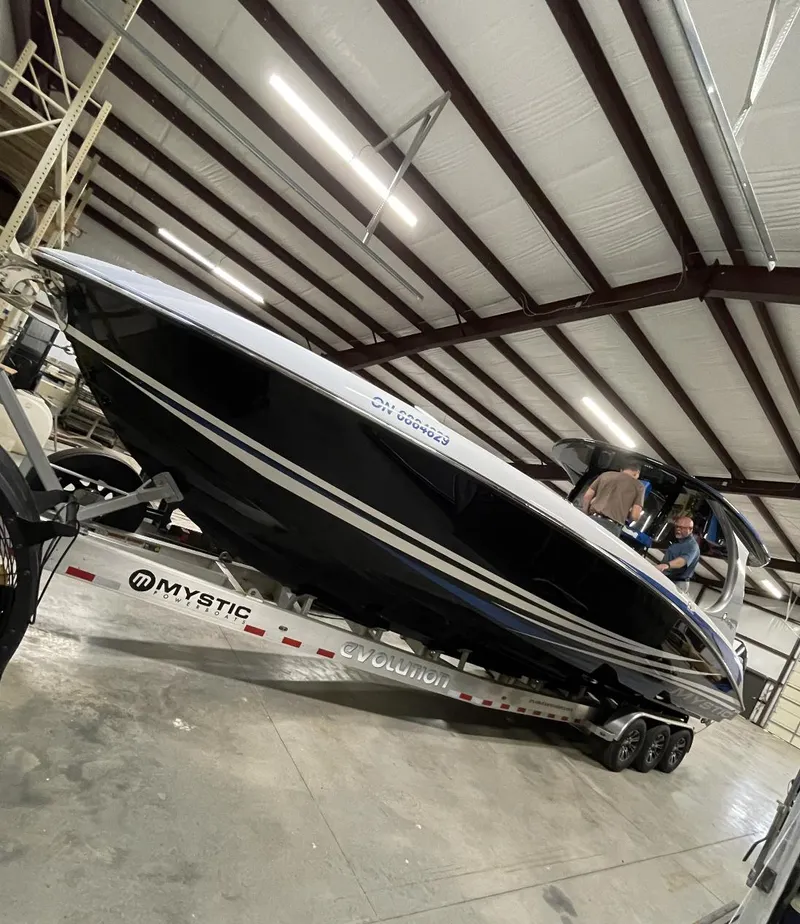 Slide: The Image of Mystic 3800 boat on trailer in warehouse, 2020 model. - 6