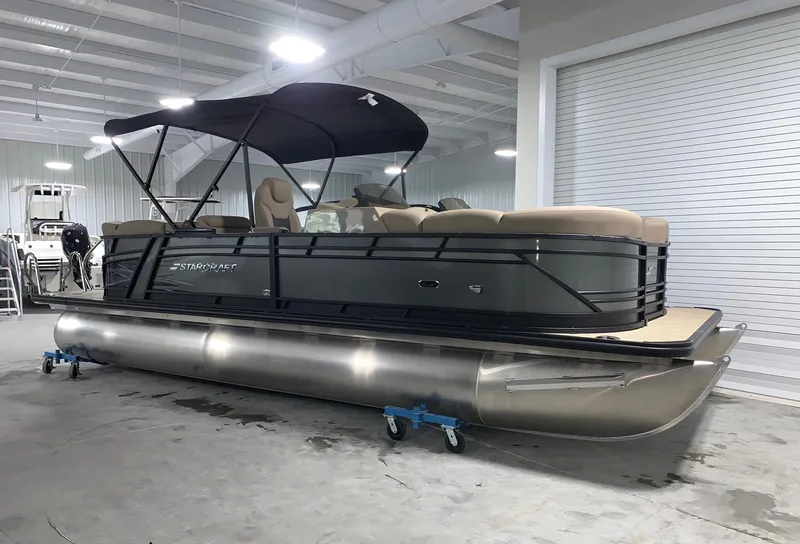 The Image of 2024 Starcraft SLS 3 DC pontoon boat in indoor showroom. - 0