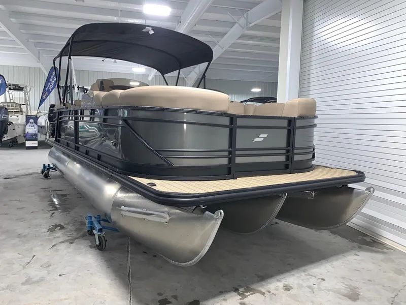 Slide: The Image of 2024 Starcraft SLS 3 DC pontoon boat in showroom. - 1