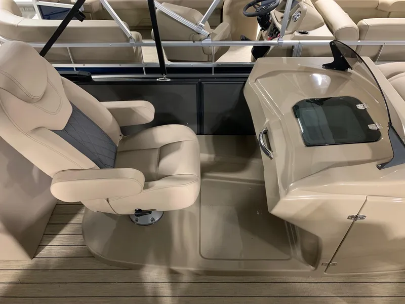 Slide: The Image of 2024 Starcraft SLS 3 DC boat interior with captain's chair and helm station. - 8
