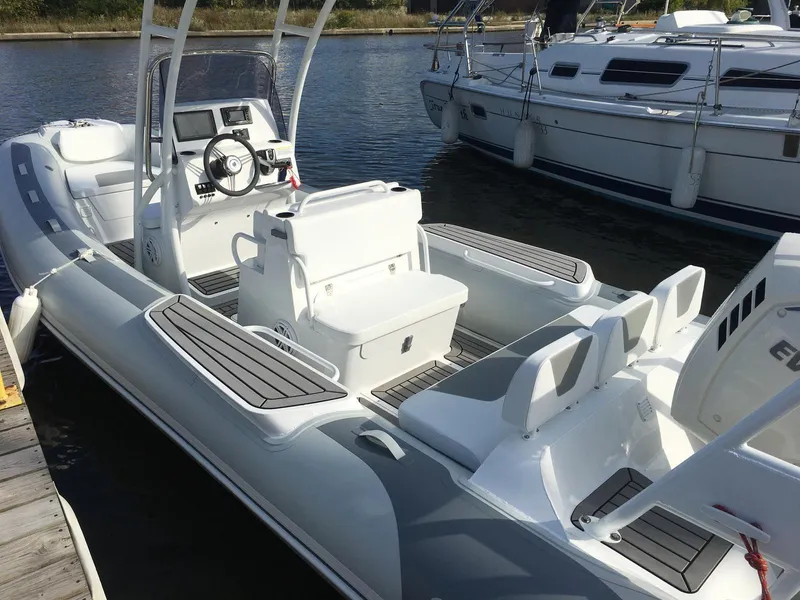 Slide: The Image of 2026 Gala VIKING 650 boat interior with deluxe black edition features and aluminum hull. - 2