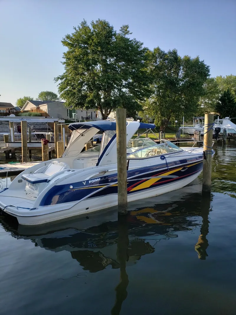 Slide: The Image of 2007 Formula 310 Sun Sport boat docked, calm water, sunny day. - 1