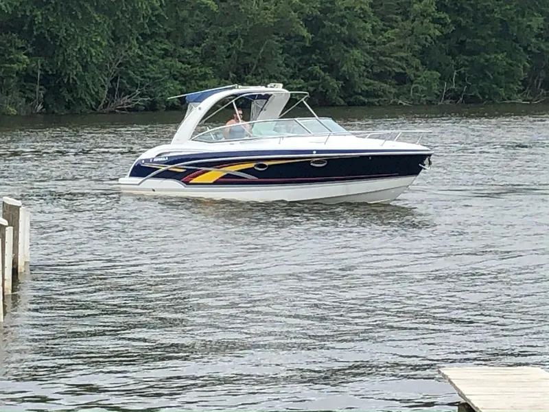 Slide: The Image of 2007 Formula 310 Sun Sport boat on a calm river. - 2