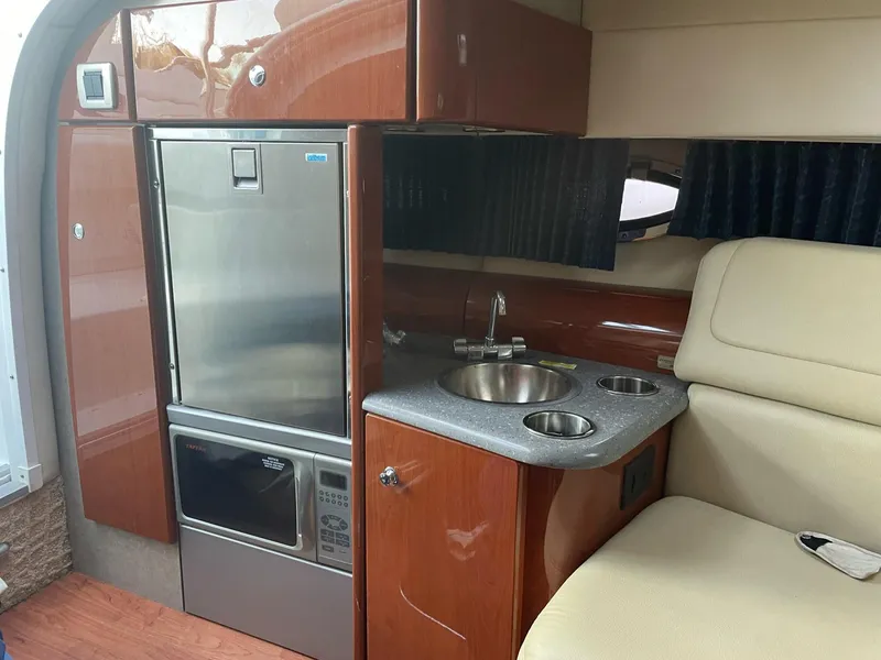 Slide: The Image of Interior of 2007 Formula 310 Sun Sport with kitchenette and seating area. - 20
