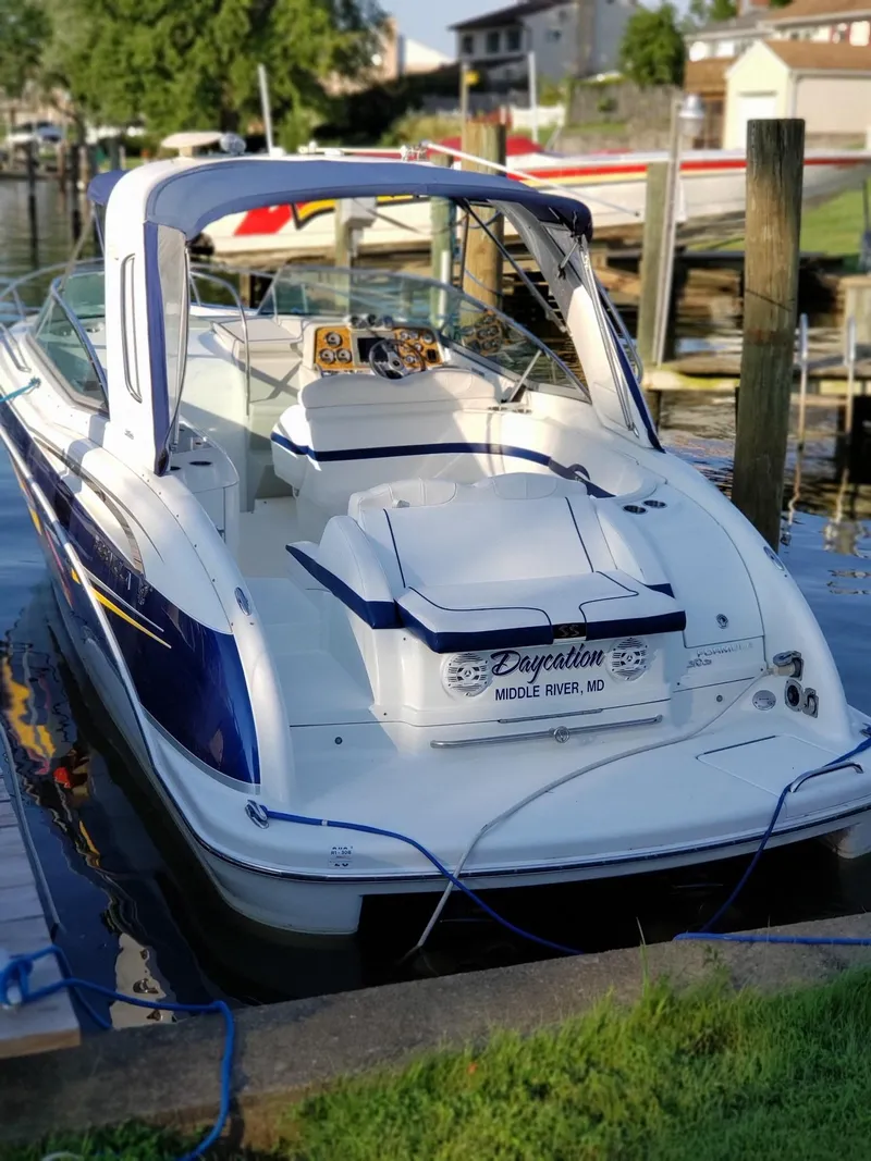 Slide: The Image of 2007 Formula 310 Sun Sport boat docked at harbor. - 23