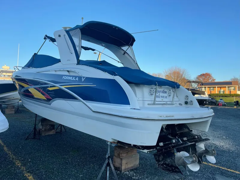 Slide: The Image of 2007 Formula 310 Sun Sport boat elevated outdoors. - 6