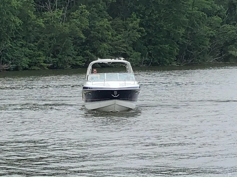 Slide: The Image of 2007 Formula 310 Sun Sport boat on a calm river. - 7
