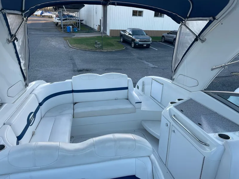 Slide: The Image of Interior of a 2007 Formula 310 Sun Sport boat with white and blue seating. - 8