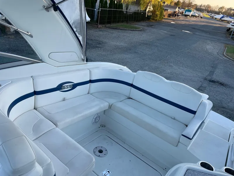 Slide: The Image of Interior of a 2007 Formula 310 Sun Sport boat with white seating. - 9
