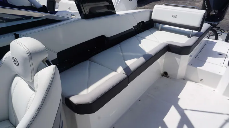 Slide: The Image of 2023 Cobalt R8 boat interior with white leather seating and modern design. - 10