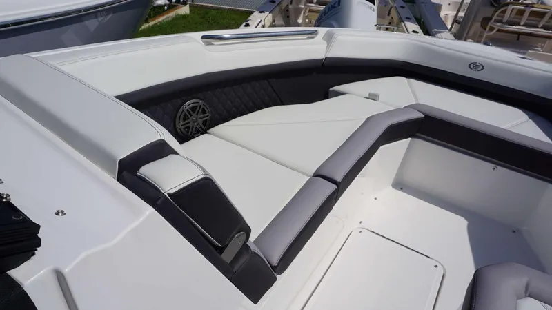 Slide: The Image of 2023 Cobalt R8 boat interior with luxurious white seating and speaker detail. - 17