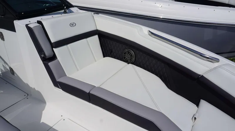 Slide: The Image of 2023 Cobalt R8 boat interior with luxurious white and gray seating. - 19