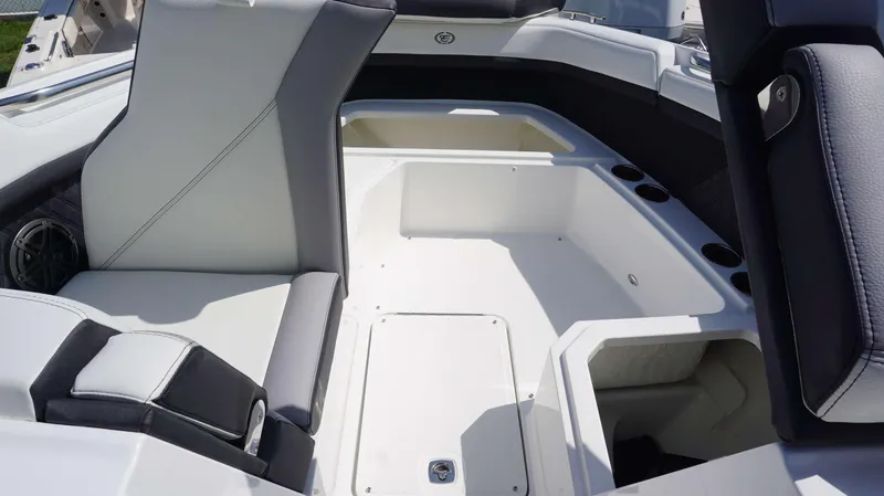 Slide: The Image of 2023 Cobalt R8 boat interior with spacious seating and cup holders. - 21