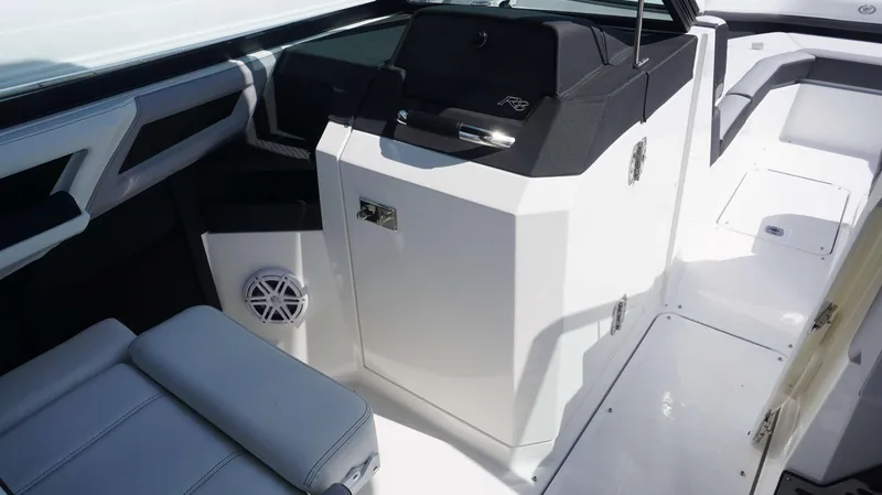 Slide: The Image of 2023 Cobalt R8 boat interior with sleek white seating and modern design elements. - 22