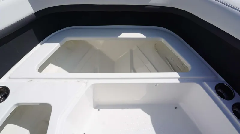 Slide: The Image of 2023 Cobalt R8 boat interior storage compartments with cup holders. - 24