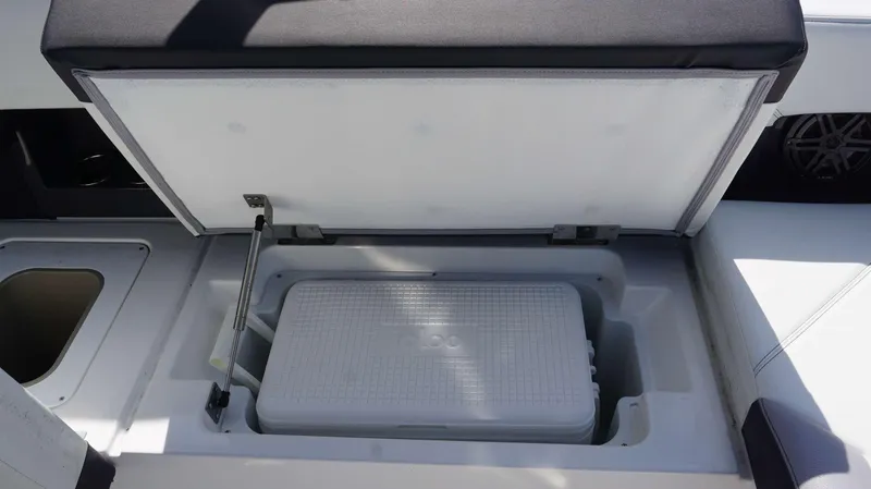 Slide: The Image of 2023 Cobalt R8 boat storage compartment with cooler inside. - 26