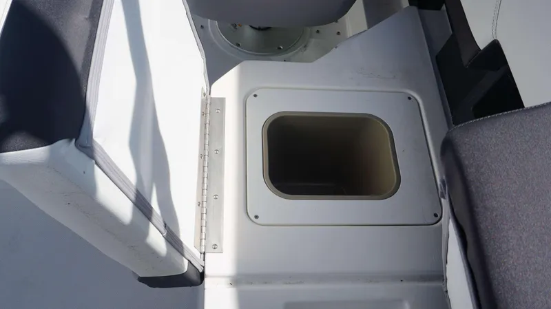 Slide: The Image of 2023 Cobalt R8 boat interior with built-in storage compartment. - 27