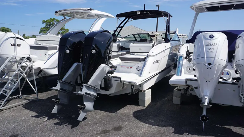 Slide: The Image of 2023 Cobalt R8 boat with dual outboard engines, displayed alongside other boats. - 4