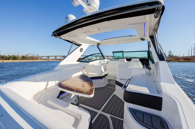 Slide: The Image of 2019 Sea Ray 320 Sundancer OB luxury boat interior on a sunny day. - 32