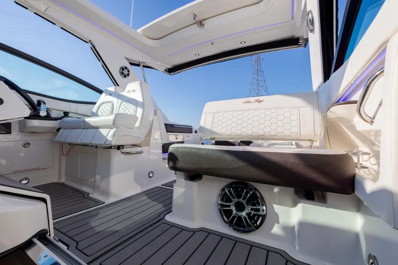 Slide: The Image of 2019 Sea Ray 320 Sundancer OB interior with seating and open roof. - 47